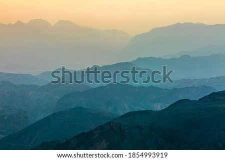 Infinity sunset view of Al Hajar mountain range, Oman.