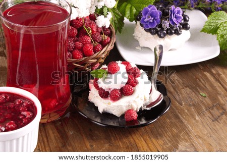 Cream cake with fresh raspberries and blueberries sweet dessert