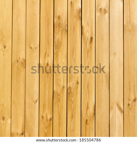 Piece of new wooden yellow fence