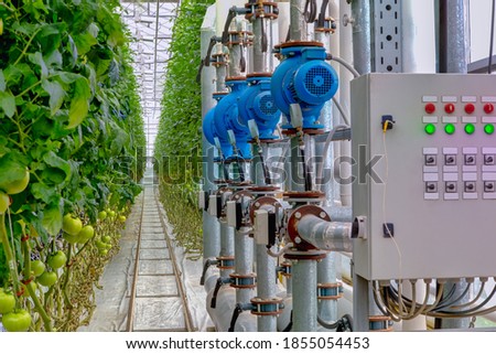 Management equipment industrial greenhouse to grow tomatoes. Monitoring sensors. Royalty-Free Stock Photo #1855054453