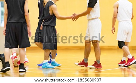 A player shaking hands after a basketball game Royalty-Free Stock Photo #1855080907