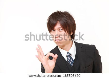 young Japanese Business man showing perfect sign