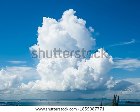 Raining cumulonimbus clouds in South China Sea Royalty-Free Stock Photo #1855087771