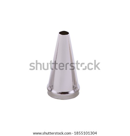 Stainless steel piping nozzle isolated on white background, copy space. Icing tip for decorating cakes and cookies. Frosting nozzle, icing