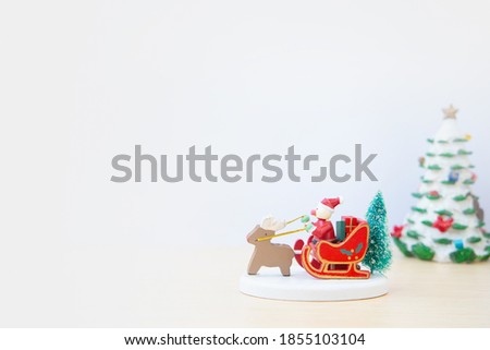  Wooden sleigh carrying an artificial Christmas tree ornament. Christmas decor,toys