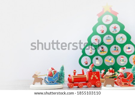  Wooden sleigh carrying an artificial Christmas tree ornament. Christmas decor,toys