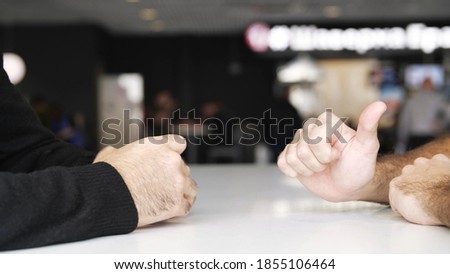 Close up of male hands during effective negotiations. Media. Hands of two men moving during talking, concept of business and making agreement.