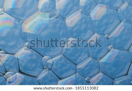 blurry abstract background of colored soap bubbles in water