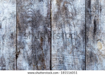 Old dark wood texture with natural exotic pattern as background 
