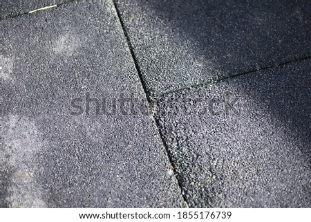 Grey paving stone, pedestrian walkway, pavement close up, the texture, top view.Cement brick squared stone floor background. Concrete paving slabs. Paving slabs