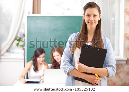 Portrait of smiling  girl looking at camera in college