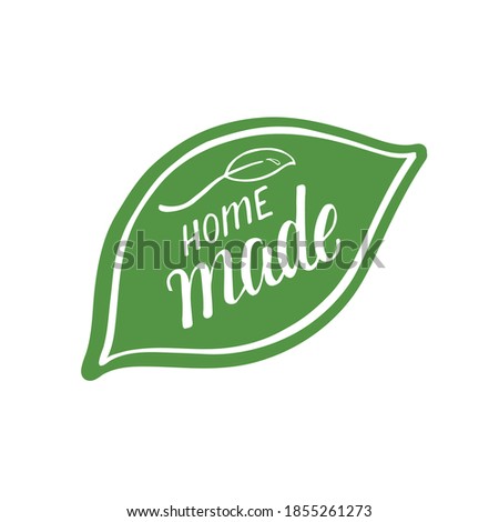 Home made. Hand written sign on green leaves for sticker, label on natural product. Vector stock illustration isolated on white background. Royalty-Free Stock Photo #1855261273
