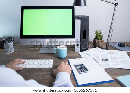 businessman working on pc computer, green screen