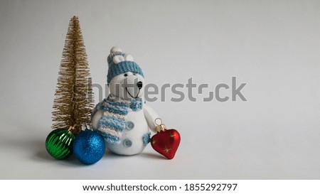 Christmas composition of teddy bear and Christmas tree decorations