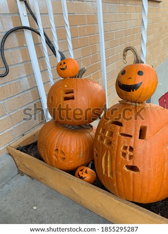 Carved pumpkins. Pumpkin houses carved for Halloween.