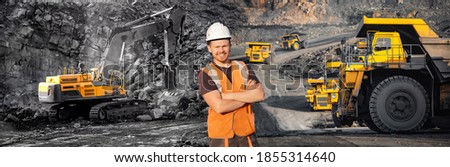 Banner open pit mine industry with man worker, big yellow mining truck for coal anthracite. Royalty-Free Stock Photo #1855314640