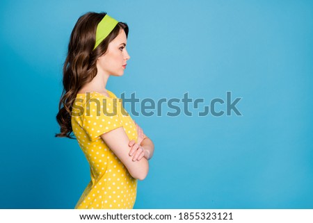 Photo portrait profile of serious woman with folded hands isolated on pastel light blue colored background