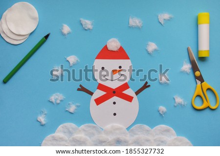 Crafts for children. Winter decoration from paper and cotton disc. Children's art project. DIY concept. Handmade Easy Paper Crafts For Kids