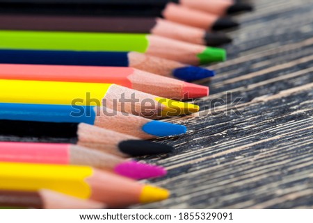 ordinary colored wooden pencil with soft lead of different colors for drawing and creativity, close up of pencils after sharpening and use, pencil made of natural eco  materials safe for children