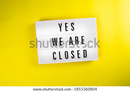 Yes We Are Closed message on lightbox on yellow background isolated. Global economic crisis, quarantine due to covid-19, shutdown of restaurants and entertainment facilities concept