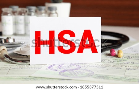 Doctor holding a card with text HSA Health Saving Account. Healthcare medical financial Insurance concept.