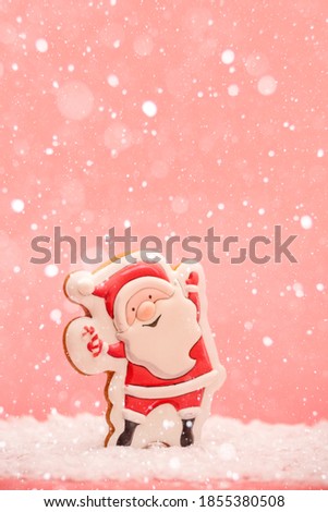 Santa Claus gingerbread on the pink background. High quality photo