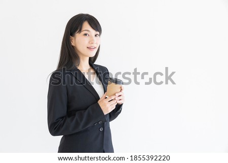 Beautiful young attractive asian businesswoman who drink coffee
