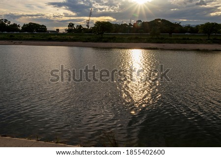 Evening sun reflected on the surface of the river