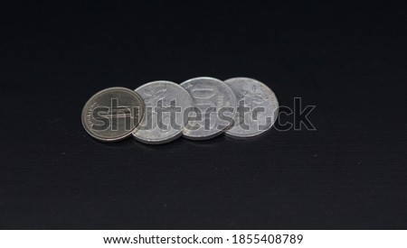 image of a coin from an indonesian bank. tools to buy things. money. coins. indonesia coin rupiah