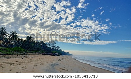 Landscape picture of seashore with sky and clouds