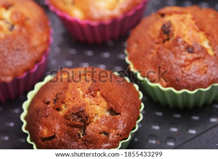 Food concept - fresh tasty pastries, cupcakes close up picture