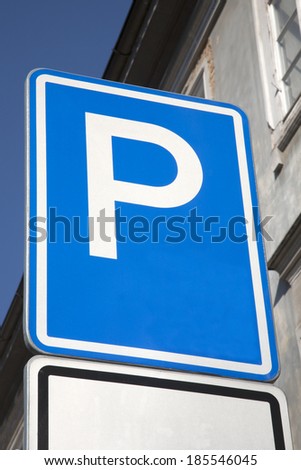 Parking Sign on Wall Background