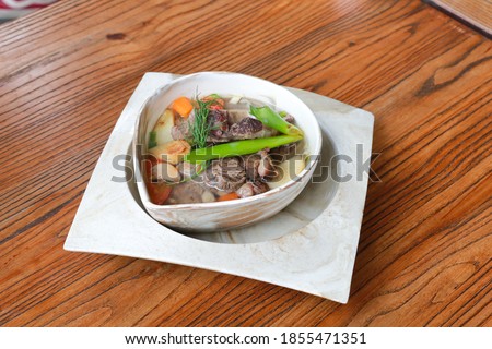 Beef Rib Soup or Sop Iga with Tomato, Carrots, and Potato.