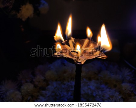 utttarakhand,india-3 may 2020:oil lamp.this is a picture of traditional oil lamp in temple.flames in dark.