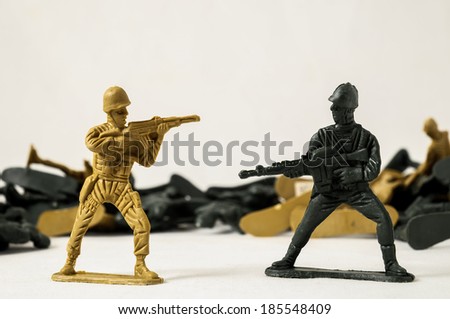 Plastic Lead Soldiers Representing War on a White Background Royalty-Free Stock Photo #185548409