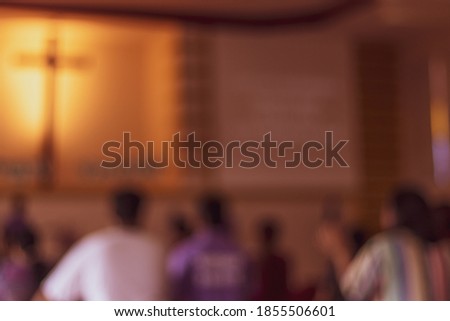 blurred of a pastor prays for people in a small christian local church ,Asian people go to church for Sunday prayers,many people are worship to God. Royalty-Free Stock Photo #1855506601