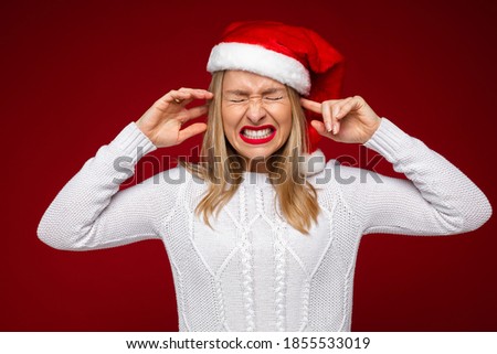 Frustrated blonde woman not feeling Christmas mood