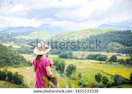 Woman looking at nature view and field, thailand