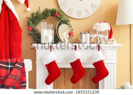 Fireplace decorated for Christmas in interior of living room