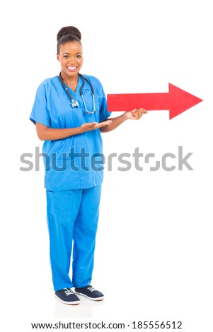 beautiful black doctor with direction arrow sign pointing right