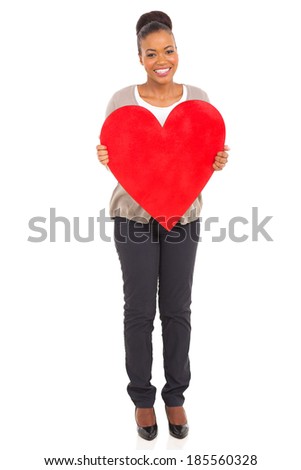 happy young african American woman holding heart shape over white background