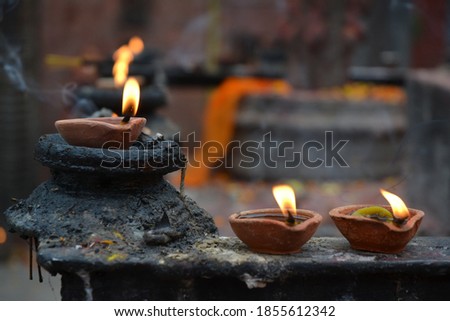 Diya or oil lamps lighting outside of a Hindu temple in Kathmandu, Nepal.