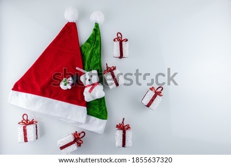 Santa's green and red hat and Christmas gifts