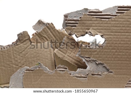 Torn, damaged cardboard for recycling isolated on white background with clipping path