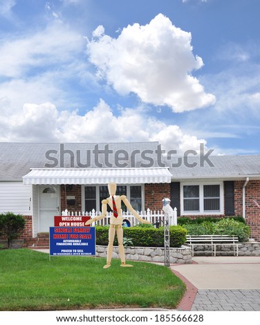 Mannequin wearing red tie showing Real Estate Open House Welcome Sign front yard lawn Suburban Brick Ranch style home landscaped Residential Neighborhood USA Blue Sky Clouds