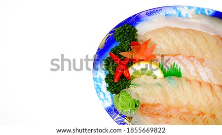 Raw fish flounder sashimi slice (flatfish sashimi) set on a take-out plate. Isolated on white background.