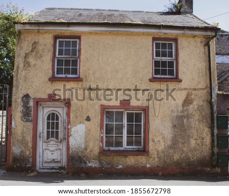 Abandoned and empty Irish Cottage in the countryside of West Cork  Royalty-Free Stock Photo #1855672798