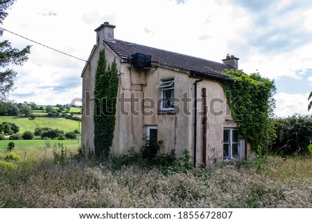 Abandoned and empty Irish Cottage in the countryside of West Cork  Royalty-Free Stock Photo #1855672807