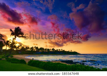 Spectacular sunset over a Pacific Ocean beach on Kauai, Hawaii, USA Royalty-Free Stock Photo #185567648