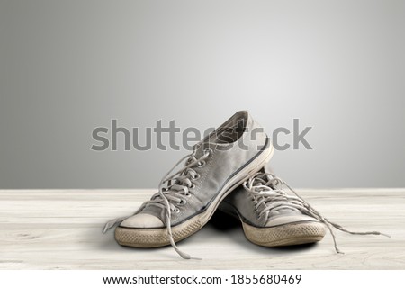 Modern sport skate shoes on wooden desk